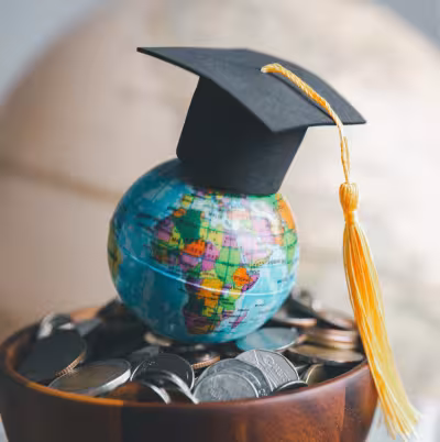 A graduation cap on a globe